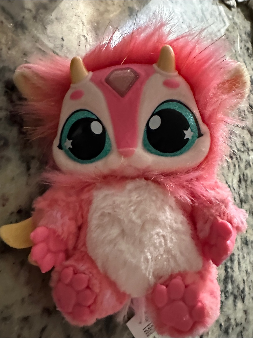 Plush Pink Fantasy Toy with Teal-Accented Eyes